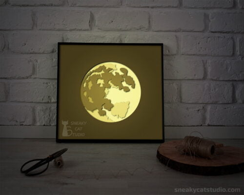 Paper layered shadow box Moon with yellow light on the table