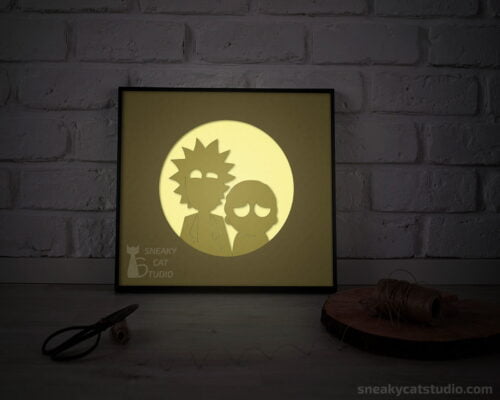 Paper layered shadow box Rick and Morty with yellow light on the table