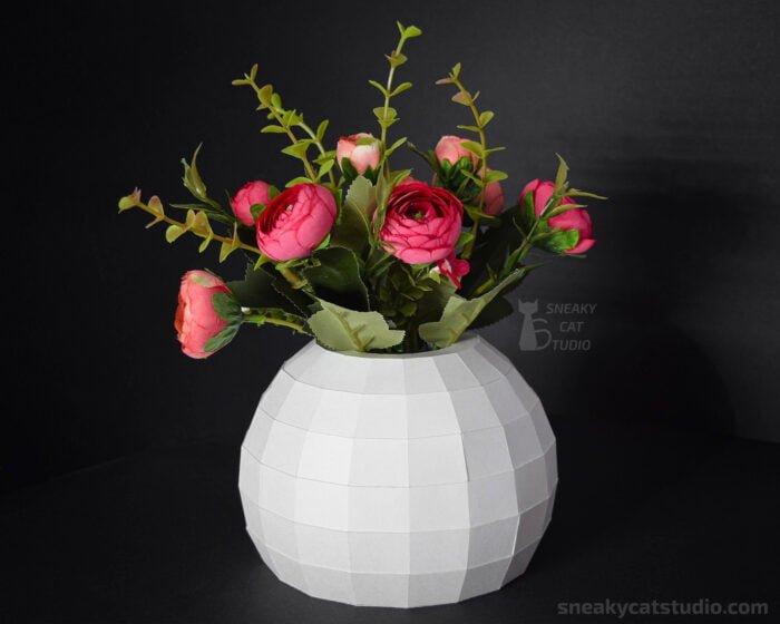 Geometric vase with flowers for interior on a black background