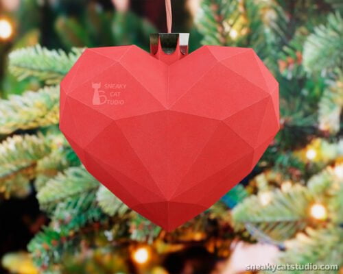 Paper Red Heart Christmas Tree Decoration on green background main view