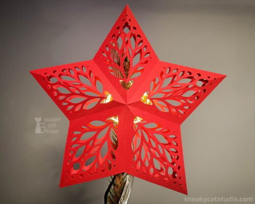 Polygonal Paper Red Star at the Christmas tree