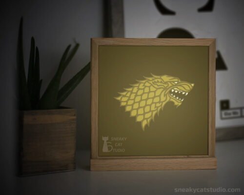 Paper layered shadow box Wolf with yellow light on the table